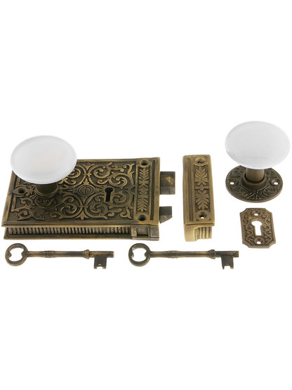 Solid Brass Scroll Rim Lock Set with White Porcelain Knobs.